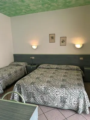 Letto o letti in una camera di Hotel Storione