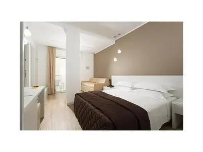 Letto o letti in una camera di Hotel Gardenia