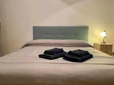 Letto o letti in una camera di Casa Ester