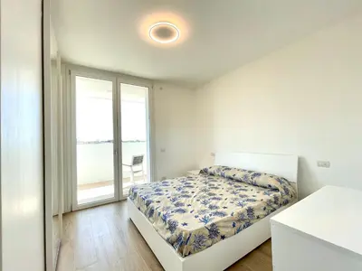 Letto o letti in una camera di BLU HOMES - Carraro Immobiliare - Family Apartments