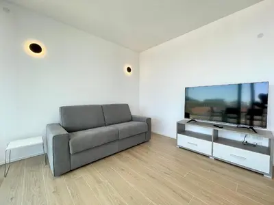 TV o dispositivi per l'intrattenimento presso BLU HOMES - Carraro Immobiliare - Family Apartments