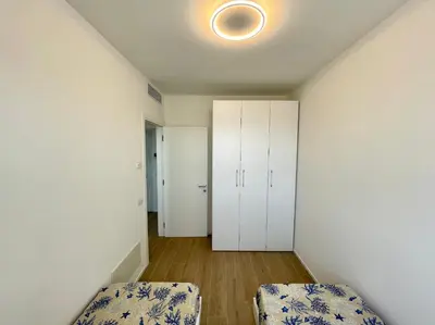 Letto o letti in una camera di BLU HOMES - Carraro Immobiliare - Family Apartments