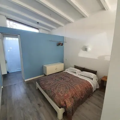 Letto o letti in una camera di B&B Ca' Loi