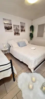 Letto o letti in una camera di Appartamento Perla Marina