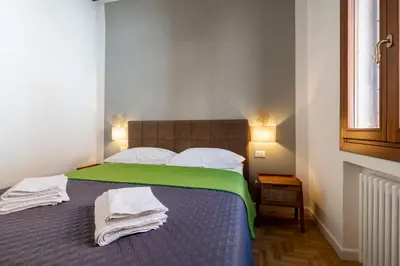 Letto o letti in una camera di Querini Suite-Balcony on canal, close to San Marco
