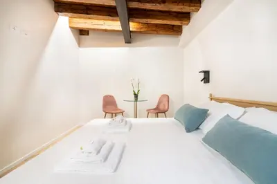 Letto o letti in una camera di Palazzina Schiavoni by Sarlux
