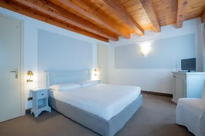 Letto o letti in una camera di Alla Corte Rossa