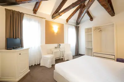 Letto o letti in una camera di Alla Corte Rossa