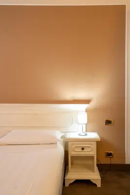 Letto o letti in una camera di Alla Corte Rossa