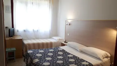 Letto o letti in una camera di Hotel Villa Dina