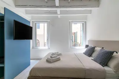 Letto o letti in una camera di Residenza SubitoSanto - Appartamento 2A 