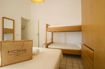 Letto o letti in una camera di Bagni Miramare - Home Immobiliare Jesolo