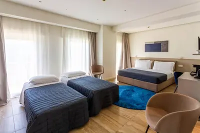 Letto o letti in una camera di Hotel Petit Palais