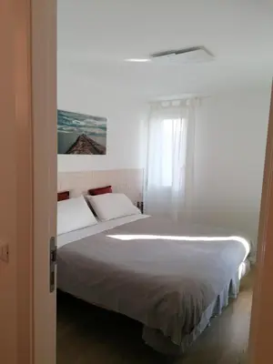 Letto o letti in una camera di VERDEPOESIA