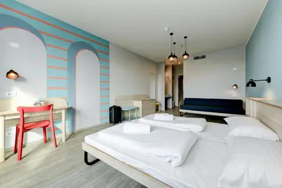 Letto o letti in una camera di MEININGER Venezia Mestre