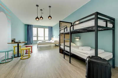 Letto o letti in una camera di MEININGER Venezia Mestre