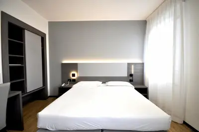 Letto o letti in una camera di Hotel Igea