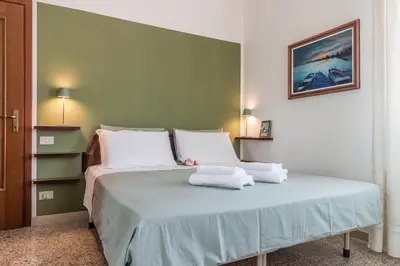 Letto o letti in una camera di Colombina House close to the Train Station