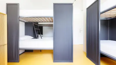 Letto o letti in una camera di Nomad Hostel