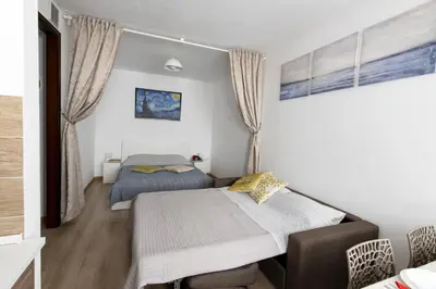Letto o letti in una camera di Appartamento con parcheggio gratuito 15min da Venezia