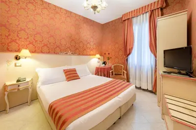 Letto o letti in una camera di Hotel San Giorgio