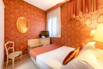 Letto o letti in una camera di Hotel San Giorgio