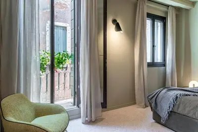 Letto o letti in una camera di Ca' Delle Carrozze Stylish 2 Bedroom loft-style