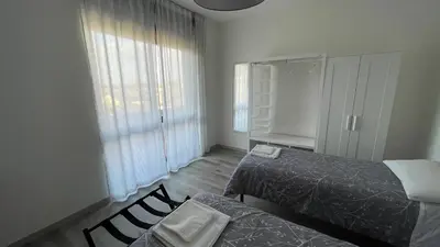 Letto o letti in una camera di OTB Italia 3 - Ampio appartamento tra Venezia e Treviso con 3 camere e terrazze panoramiche