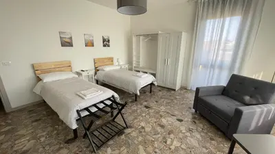 Letto o letti in una camera di OTB Italia 3 - Ampio appartamento tra Venezia e Treviso con 3 camere e terrazze panoramiche