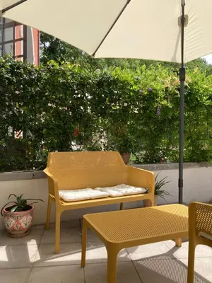 Area soggiorno di mini loft Lido with own sunny & private garden
