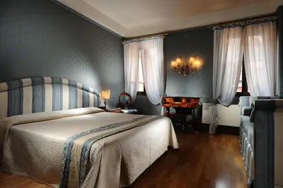 Letto o letti in una camera di Hotel Abbazia
