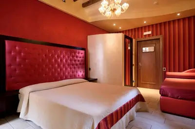 Letto o letti in una camera di Hotel Abbazia