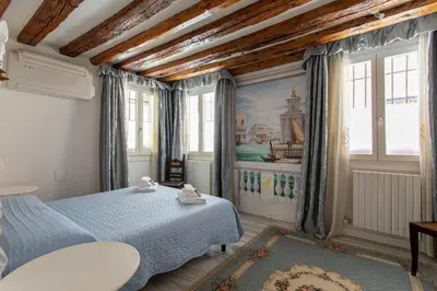 Letto o letti in una camera di Appartamento S. Maurizio - Venezia