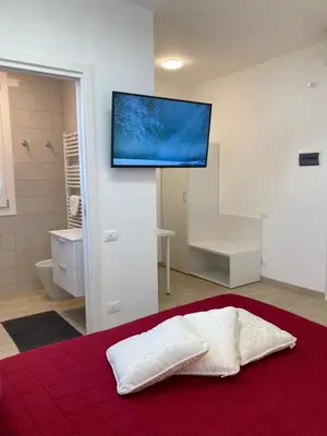 Letto o letti in una camera di ALLA CASA DEI NONNI