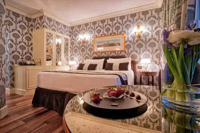 Letto o letti in una camera di Londra Palace Venezia