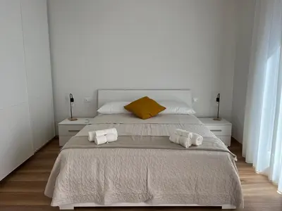Letto o letti in una camera di Ca' Luciano alloggio a Lido di Venezia