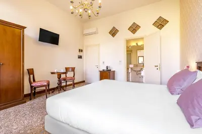 Letto o letti in una camera di Residenza Centopietre - Dorsoduro by Wonderful Italy