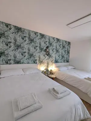 Letto o letti in una camera di Urban Oasis family apt 10 mins from Venice