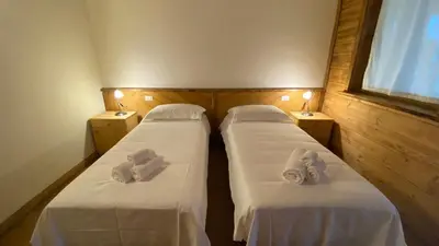 Letto o letti in una camera di Locanda Al Cacciatore