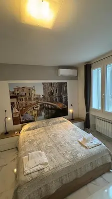 Letto o letti in una camera di Calle de le Pazienze Apartments