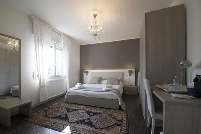 Letto o letti in una camera di Al Portico Guest House