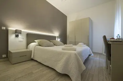 Letto o letti in una camera di Al Portico Guest House