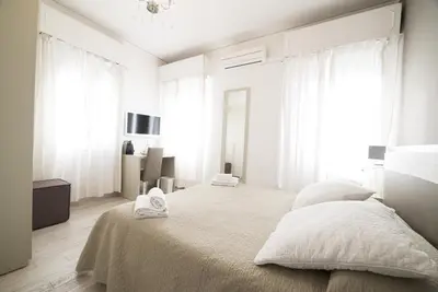 Letto o letti in una camera di Al Portico Guest House