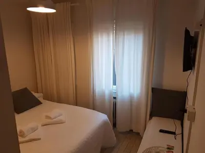 Letto o letti in una camera di Al Portico Guest House
