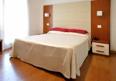 Letto o letti in una camera di Hotel Mezzaluna
