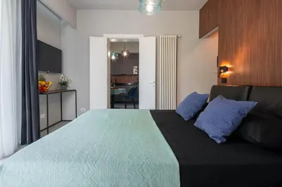 Letto o letti in una camera di Officine Cavour - Appartamenti la Quercia