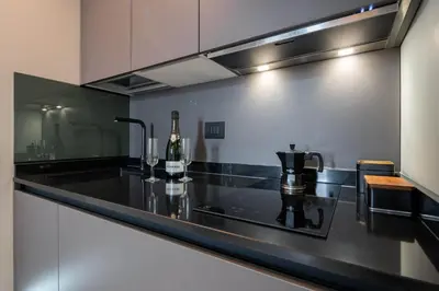 Cucina o angolo cottura di Officine Cavour - Appartamenti la Quercia