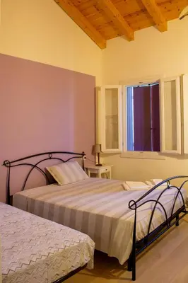 Letto o letti in una camera di Ranch borgo bella vita