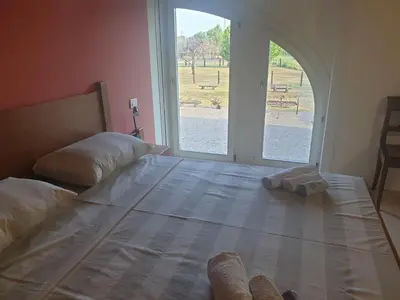 Letto o letti in una camera di Ranch borgo bella vita