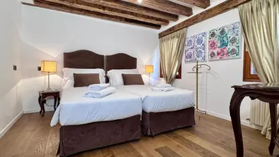 Letto o letti in una camera di Ca' ai Sospiri